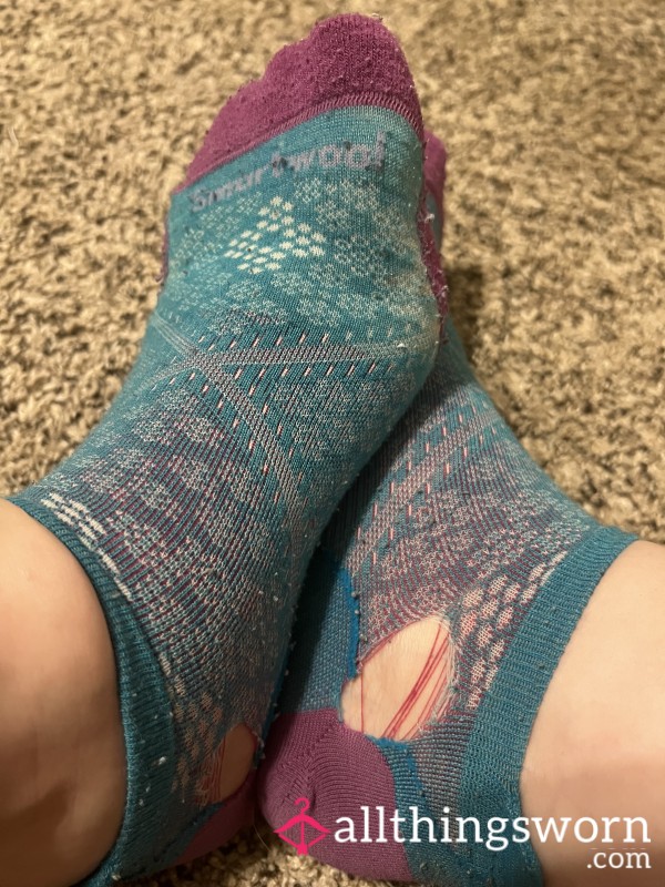 Blue And Purple Smartwool Socks With Holes