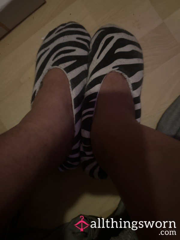 Feet In  Worn Slippers