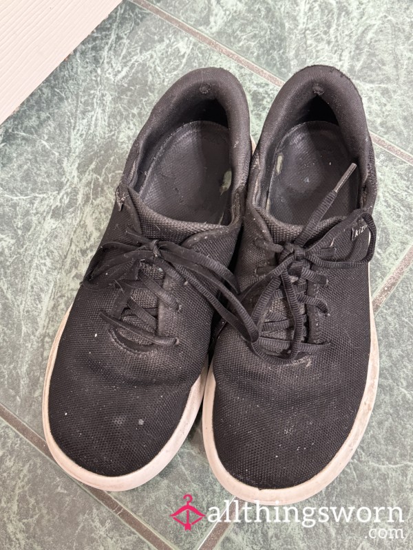 Well-worn Black Sneakers