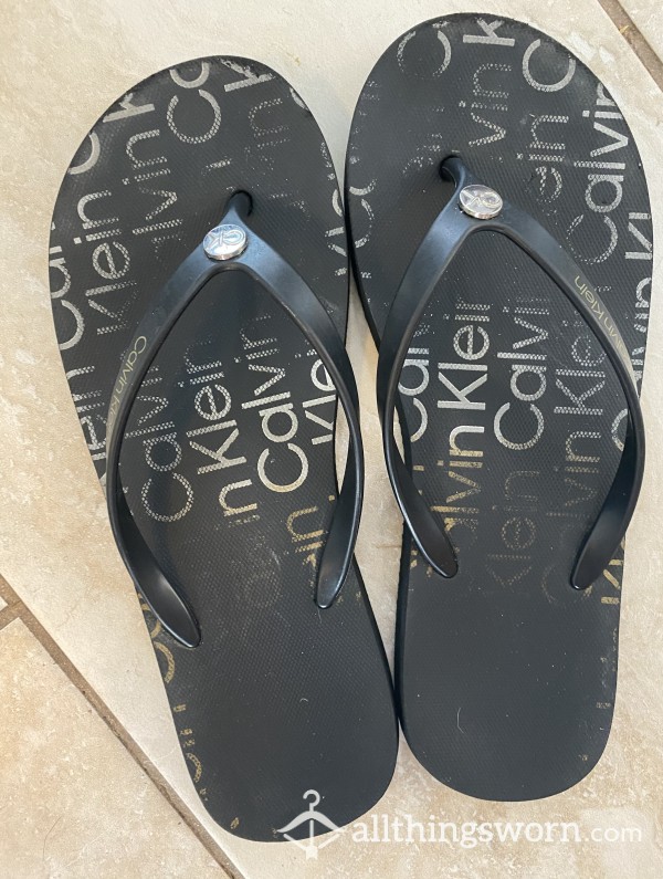 SOLD Worn Black Calvin Klein Flip Flops With Footprints